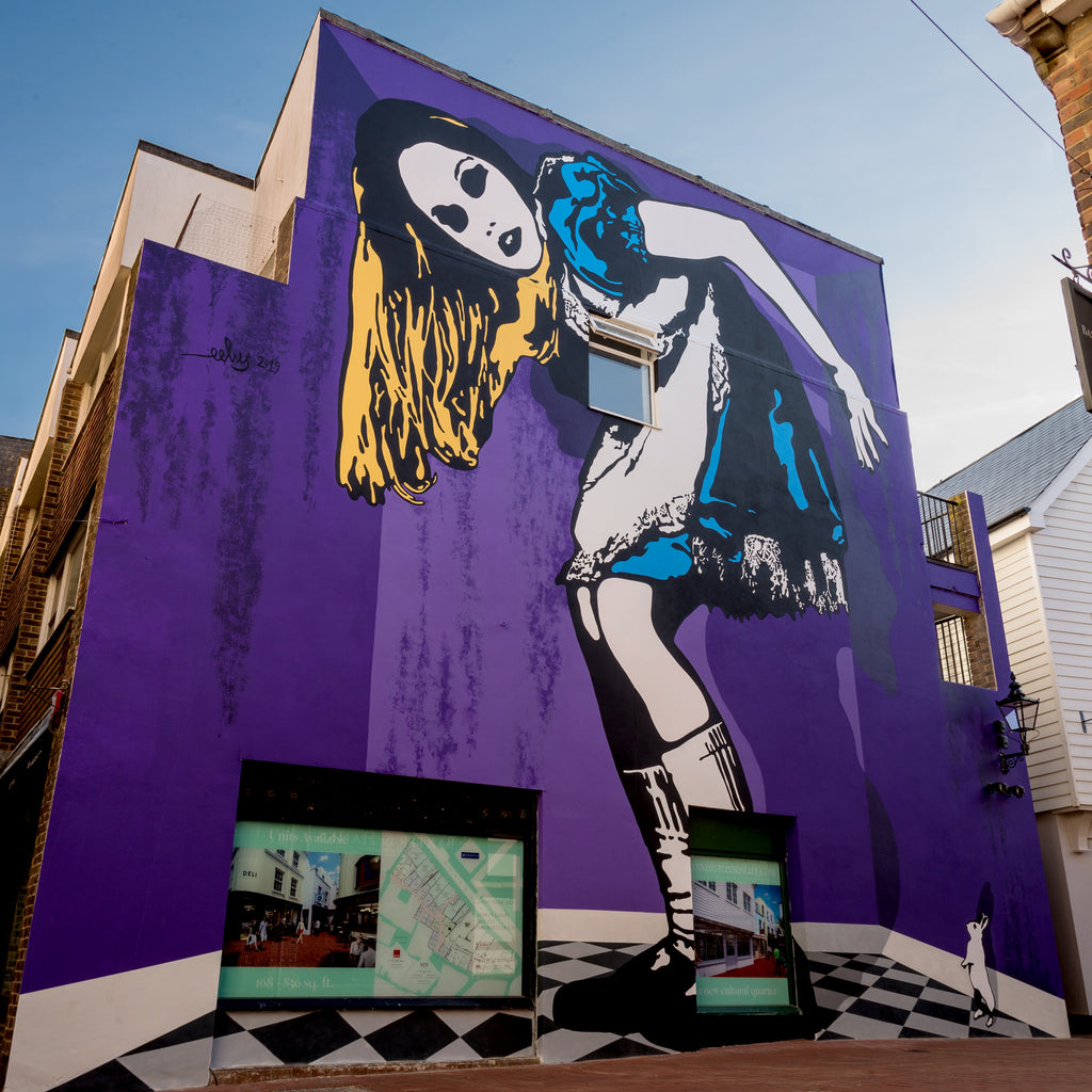 Alice in Wonderland mural in Brighton, England by artist Lee Eelus